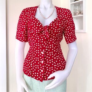 1980s red with white polka dots structured short sleeve tie front top by Leger